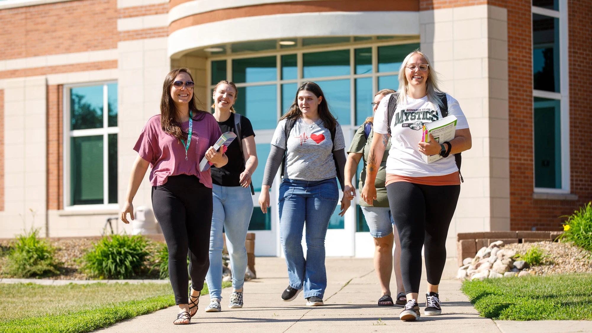 adult students walking out of the Jack Science Center on Bismarck State College Campus
