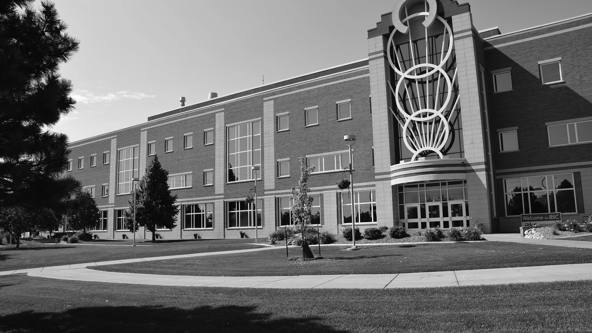 Jack Science Center building on Bismarck State College brick building with three white rings